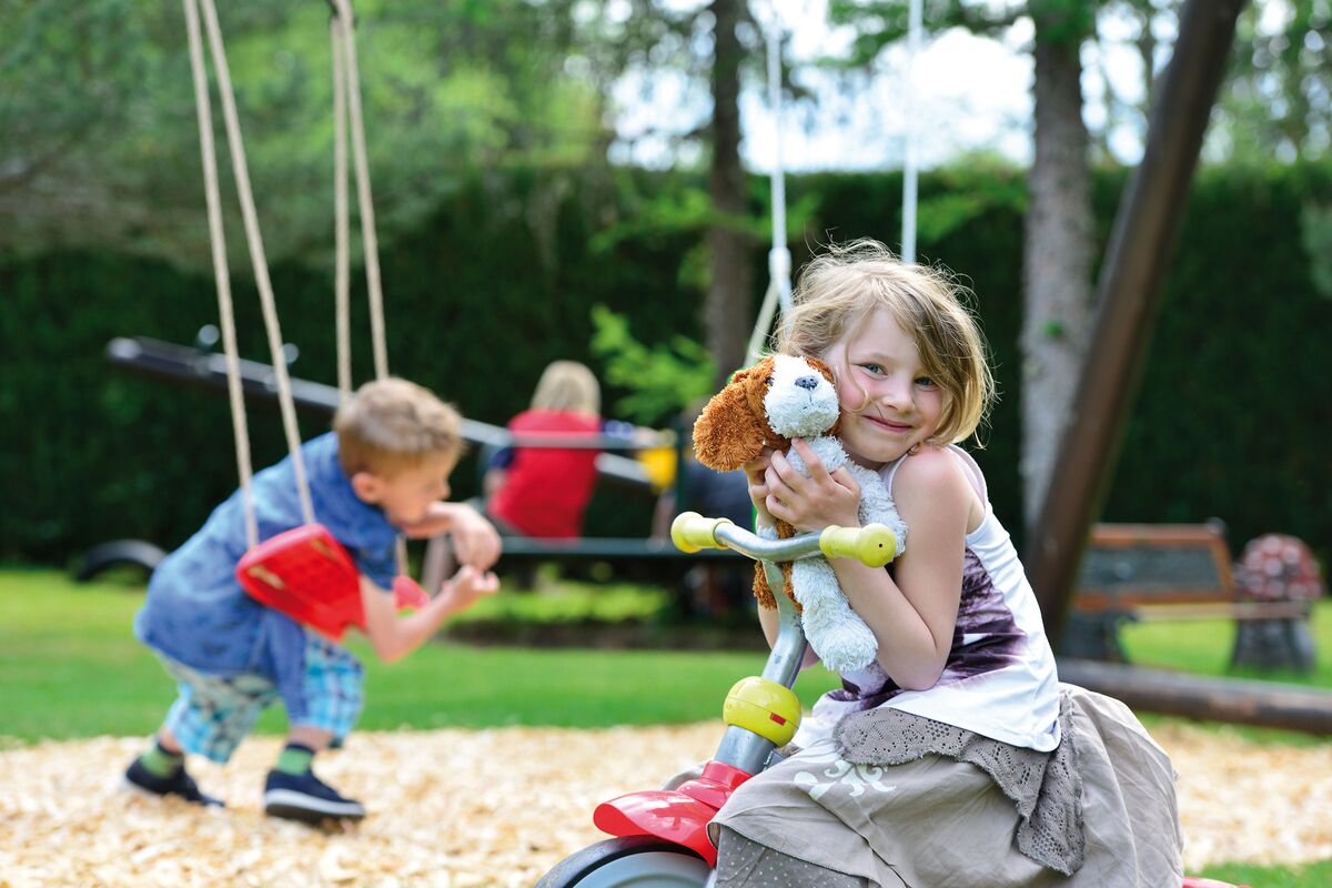 Children's playground in the hotel park with lots of children playing