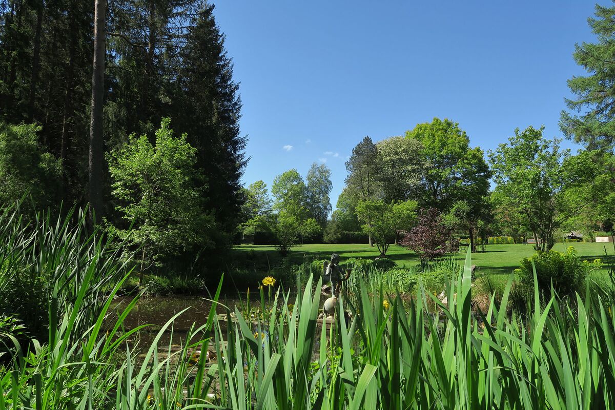 Private park by a body of water with far-reaching views